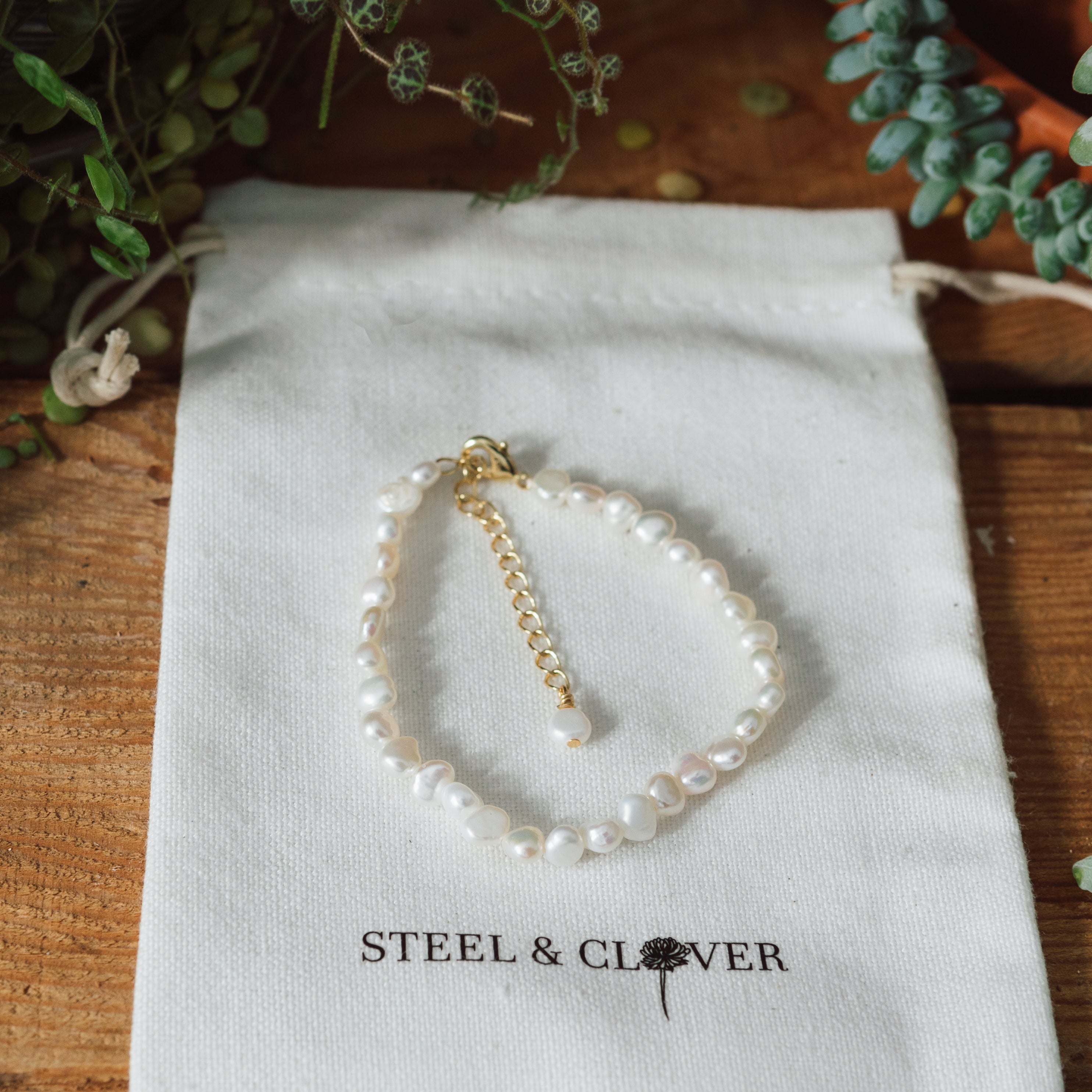 The Sandbar Pearl Bracelet is a refined blend of elegance and simplicity, featuring luminous pearls on a delicate, minimal chain. Designed for effortless everyday wear or elevated styling, it adds a timeless coastal touch to any look.